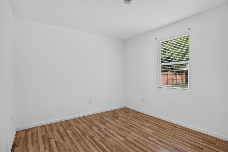 Bedroom with window and wood-look floor at 1012 Fruit Cove Rd, Jacksonville, FL 32259