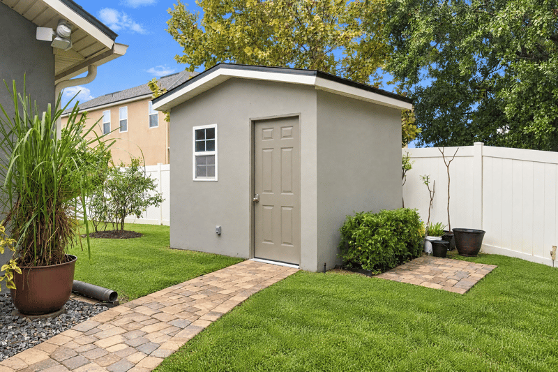 Storage shed with paver walkway at 10923 Black Diamond Ct, Jacksonville, FL