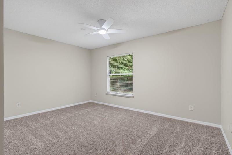 Bedroom with carpet and window at 1648 Glen Laurel Dr, Middleburg, FL 32068