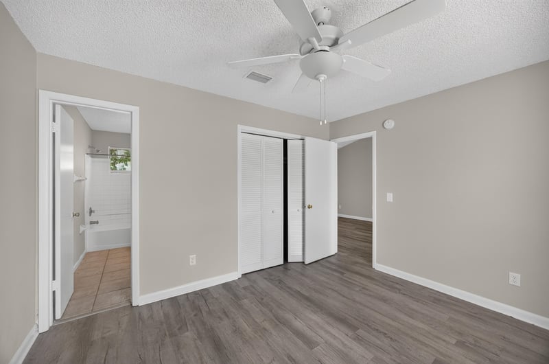 Hallway with multiple doorways and tile flooring at 2717 Trollie Ln, Jacksonville, FL