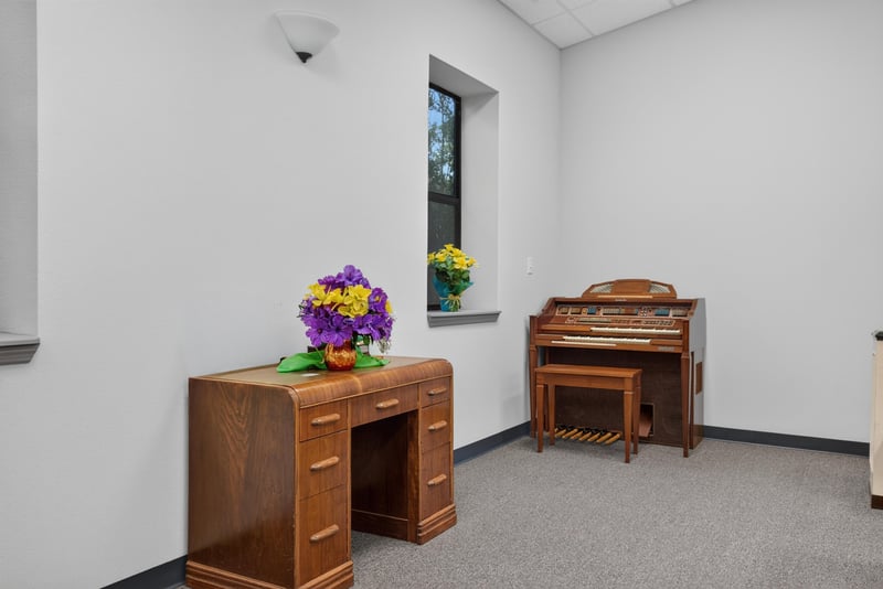 Room with piano, desk and flowers at 1038 County Rd 315, Melrose