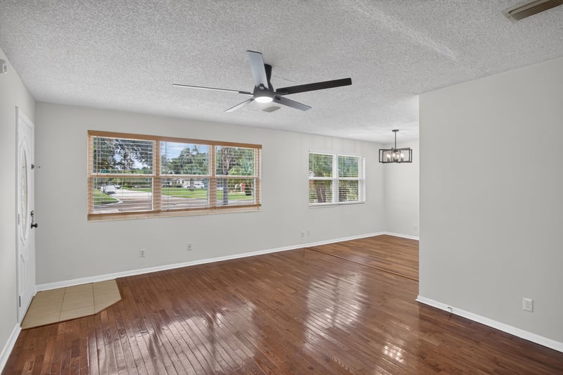 Living area with windows and wood floor at 4039 Habana Ave, Jacksonville, FL
