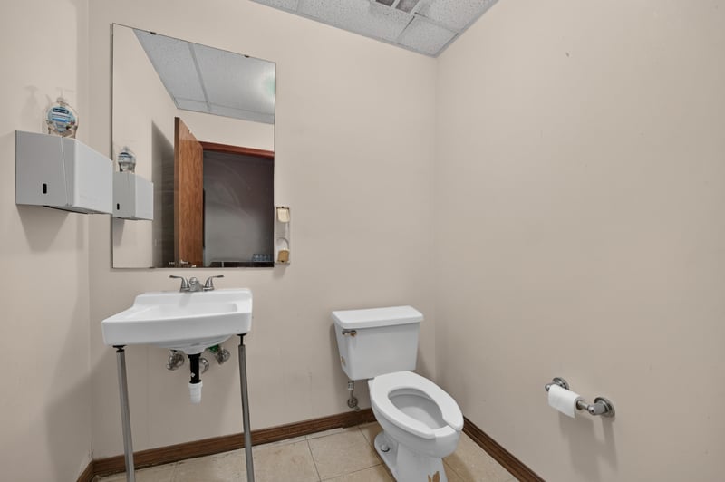 Bathroom with pedestal sink, mirror cabinet and toilet at 1543 Kingsley Ave #19, Orange Park, FL 32073