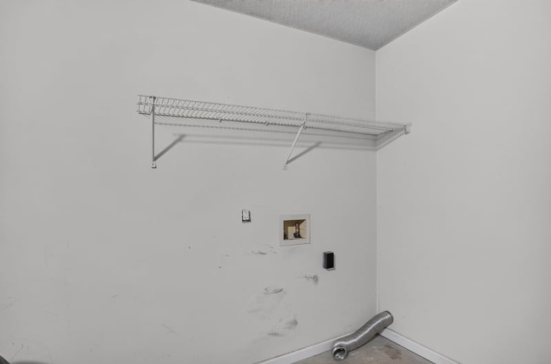 Utility area with wire shelving near garage at 8519 Blazing Star Ct, Jacksonville, FL 32210