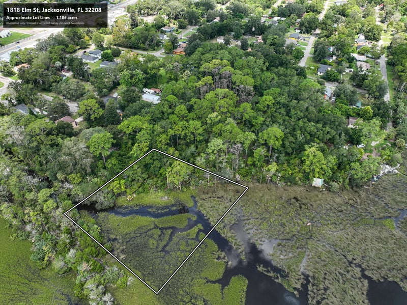 Aerial view of parcel boundary over wooded lots and roads at 1818 Elm St, Jacksonville, FL 32208