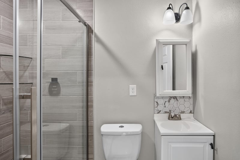 Bathroom with glass-enclosed tile shower at 7015 Miss Muffet Ln N, Jacksonville, FL 32210