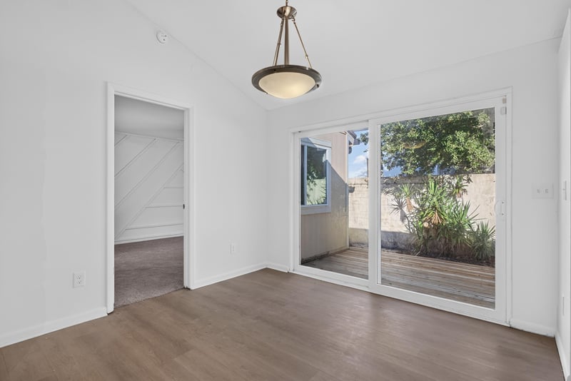 Room with sliding glass door to deck, unfurnished at 8177 Virgo St, Jacksonville, FL 32216