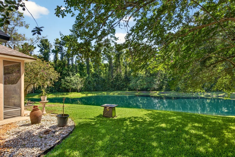 Aerial of the backyard and pond at 11675 Magnolia Estates Rd, Jacksonville, FL 32223