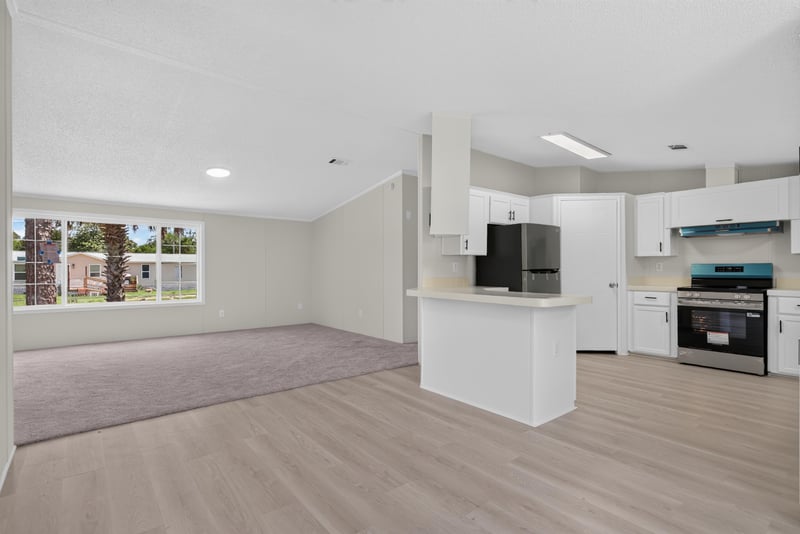 Open kitchen with island and counter seating at 7603 Coach Park Dr, Jacksonville, FL 32244