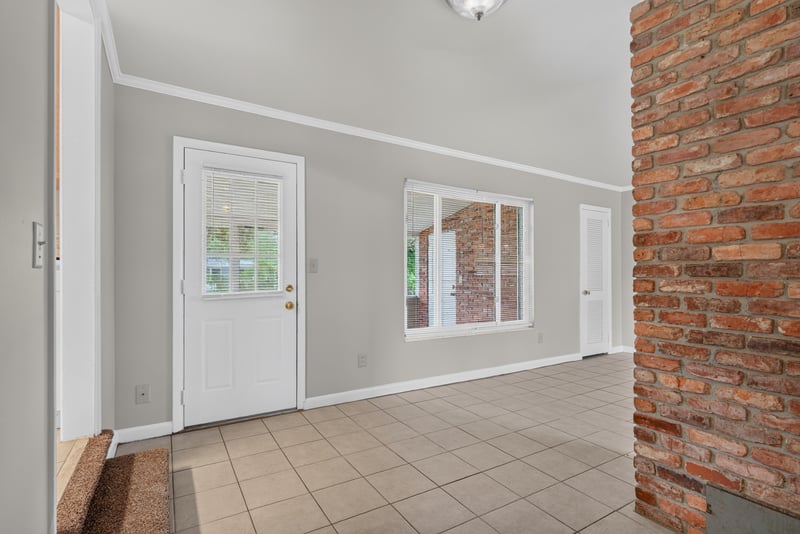 Living room with French doors to the yard at 2618 Arlex Dr E, Jacksonville, FL