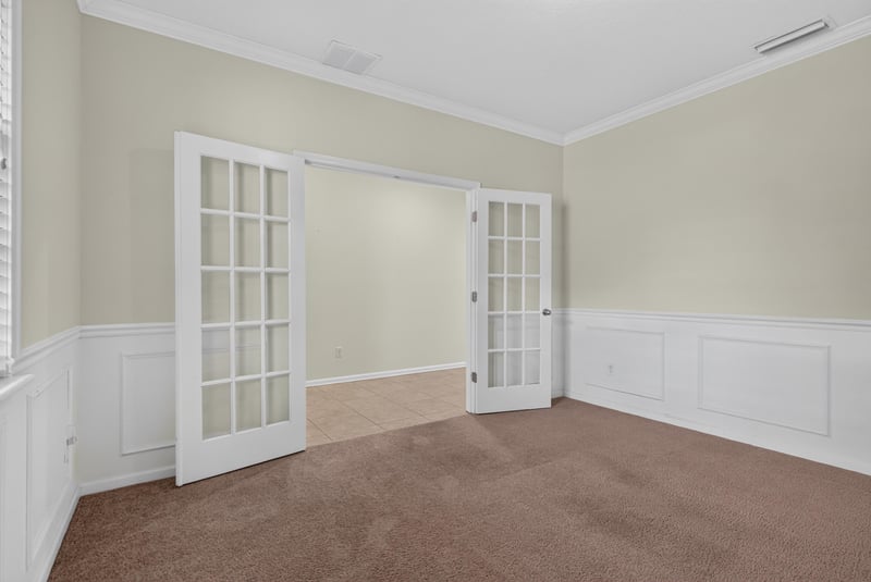 Room with double French doors and carpet at 263 Gilmore Ln, Orange Park, FL 32065