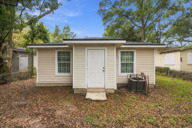 Side exterior with door and outdoor AC unit at 219 Shortreed St, Jacksonville, FL 32254