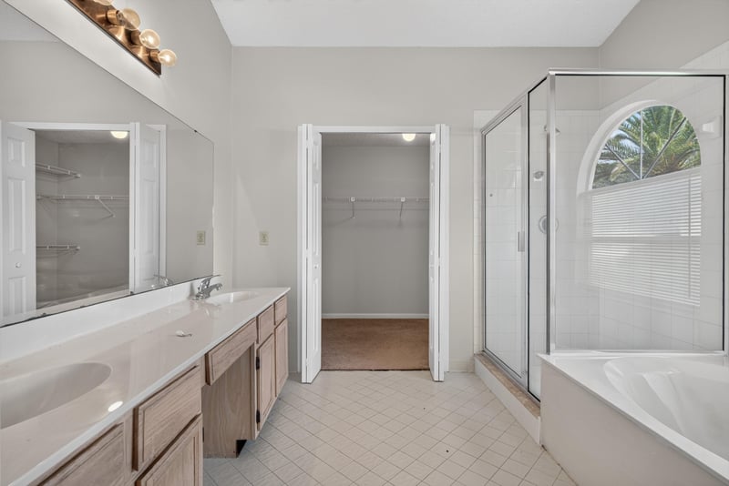 Primary bathroom with dual-sink vanity and glass shower at 400 Ashcroft Landing Dr, Jacksonville, FL 32225