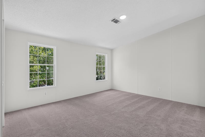 Bedroom with two windows, unfurnished at 7603 Coach Park Dr, Jacksonville, FL 32244