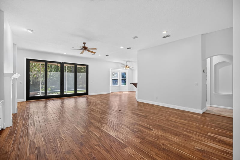 Living area panorama with wood floors and windows at 11675 Magnolia Estates Rd, Jacksonville, FL 32223
