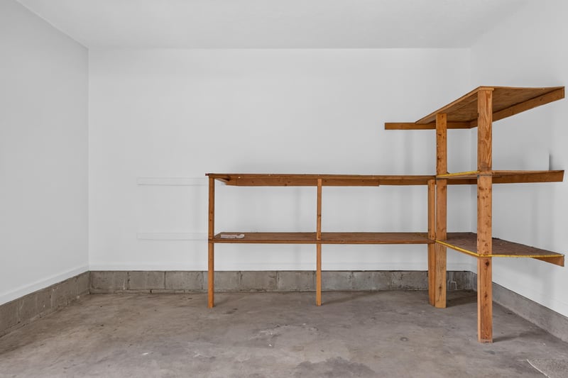 Garage interior with wood shelving along the wall at 2829 Blackberry Ave