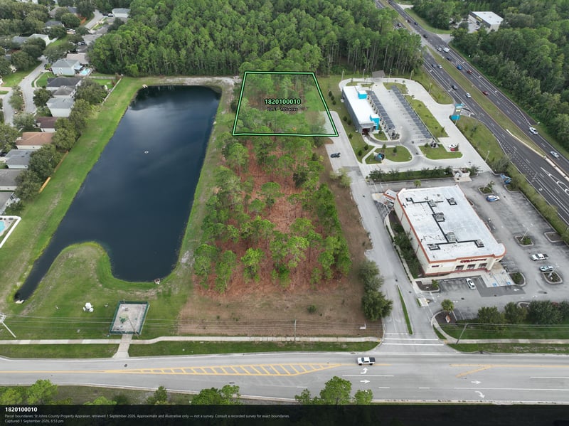 Aerial view of the pond and parcel outline beside the road at 4900 US-1, St. Augustine, FL 32086