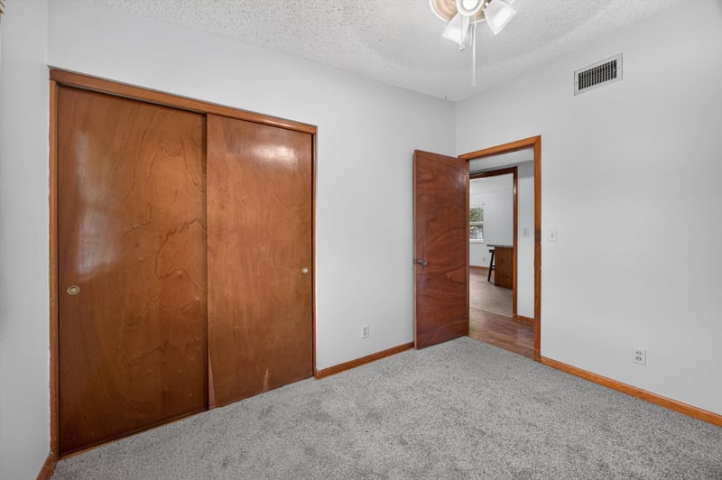 Bedroom with carpet and closet doors at 11462 Elane Dr, Jacksonville, FL