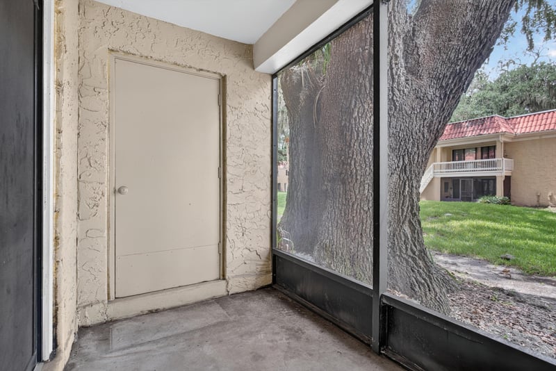 Screened porch storage closet door at 5811 Atlantic Blvd unit 47, Jacksonville, FL 32207