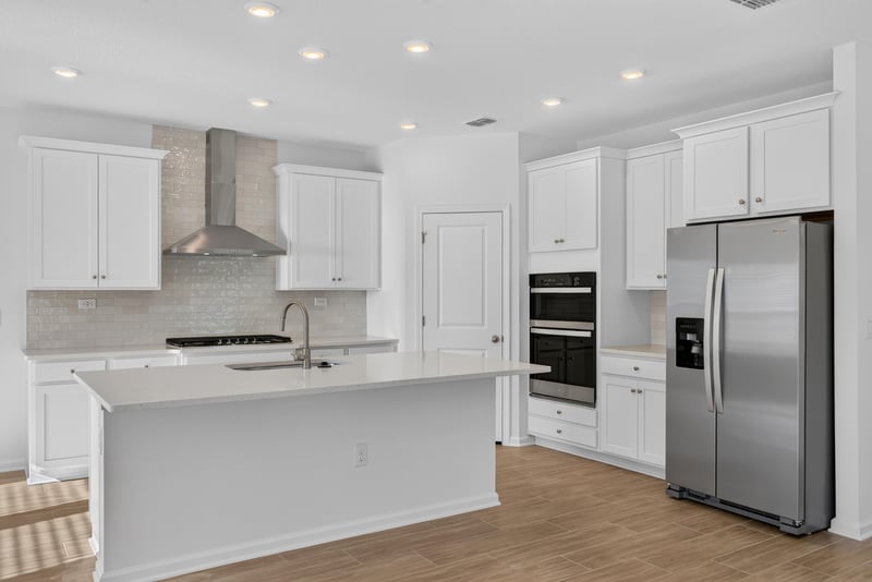Kitchen island with quartz counters and stainless appliances at 269 Bluegrass Wy, St. Augustine, FL 32092