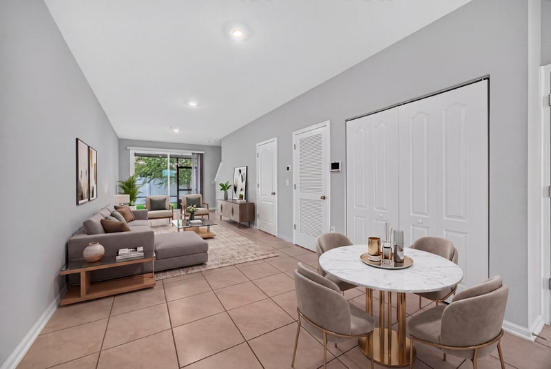 Living room and dining area with tile floor and round table at 2837 Black Buck Cir, Jacksonville, FL 32225