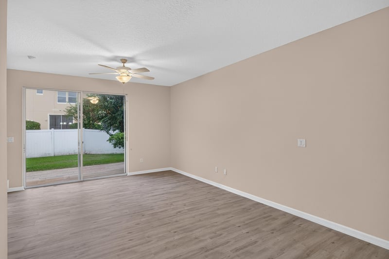 Living room sliding glass door to backyard at 3762 Hartsfield Forest Cir, Jacksonville, FL 32277