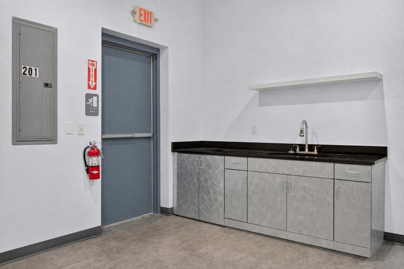 Utility area with sink, counter, and exit door at 7240 Golden Wings Rd building 100, Jacksonville, FL 32244