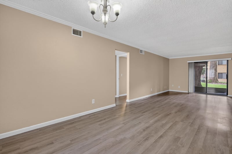 Empty dining area with chandelier and hallway view at 5811 Atlantic Blvd unit 47, Jacksonville, FL 32207