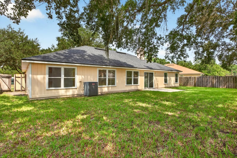 Back exterior view across rear yard at 456 Bay Point Way N, Jacksonville, FL 32259