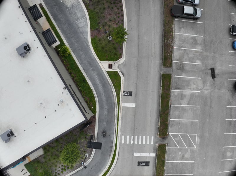Aerial view of rooftop and striped parking rows at 9406 Atlantic Blvd, Jacksonville, FL 32225