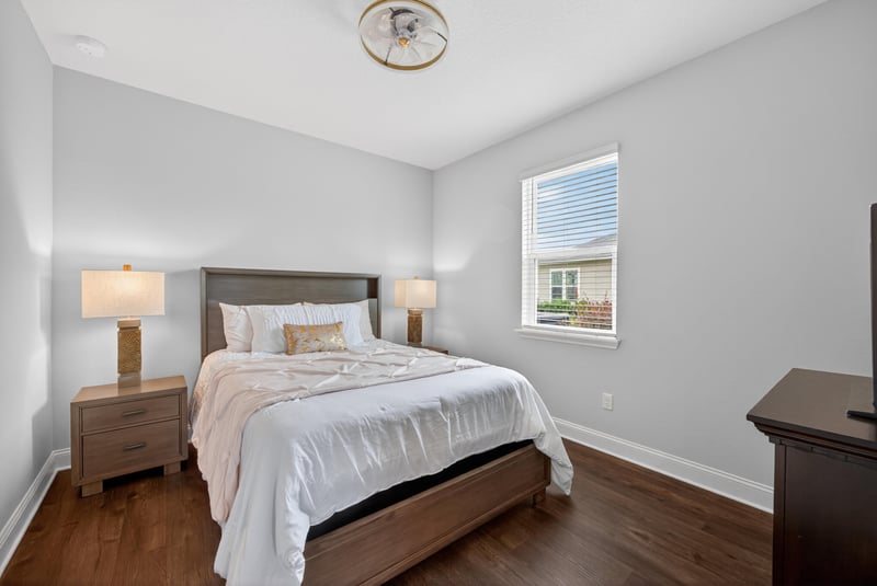 Bedroom with wood floors and windows at 85491 Fall River Pkwy, Fernandina Beach, FL 32034