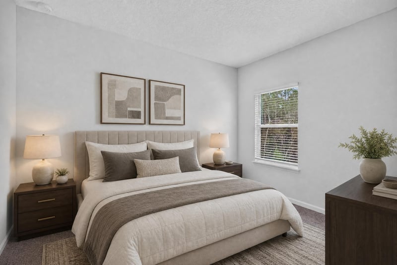 Bedroom with nightstands and window, virtually staged at 9905 Ansley Lake Dr, Jacksonville, FL