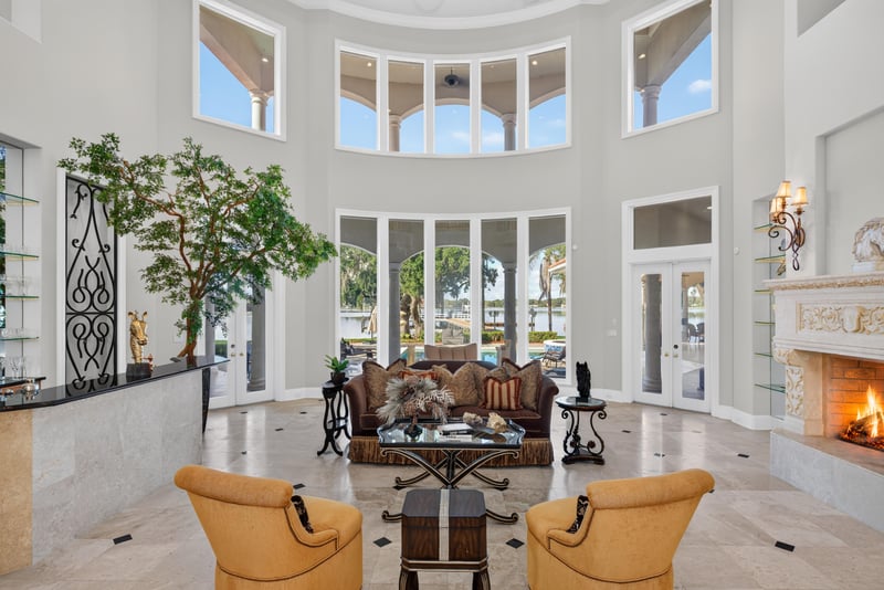 Living room with fireplace and wrought iron wall sconces at 344 Broward Rd, Jacksonville, FL