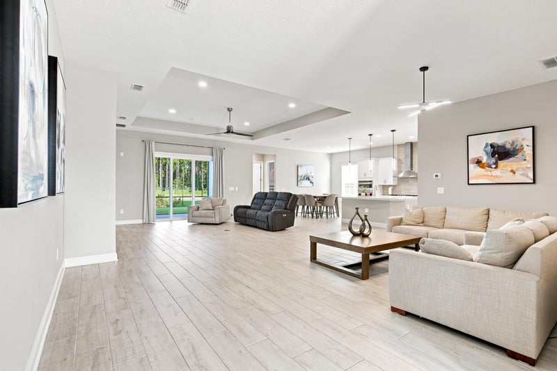 Open living room and kitchen with wood-look flooring at 27 Holly Rdg Wy, St. Augustine, FL