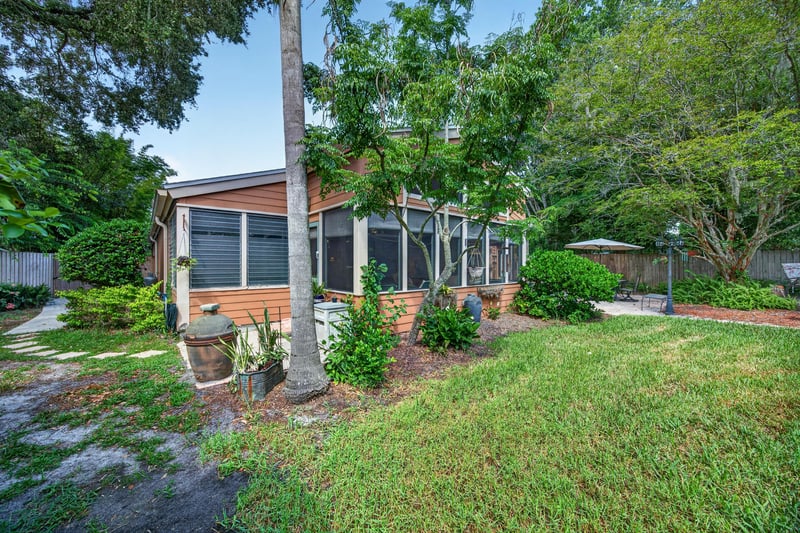 Rear exterior with screened porch at 4837 Pareja Ct, Jacksonville, FL 32225