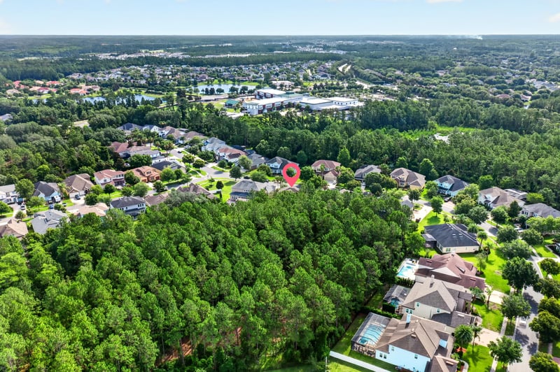 Aerial view of rooftops and tree canopy in Ponte Vedra Beach, FL