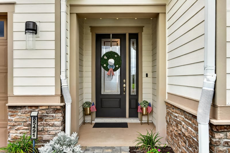 Front door entry with stone accents at 85491 Fall River Pkwy, Fernandina Beach, FL 32034