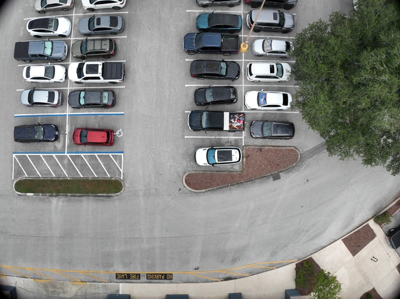 Aerial view of parking lot and landscaped entrance at 9406 Atlantic Blvd, Jacksonville, FL 32225