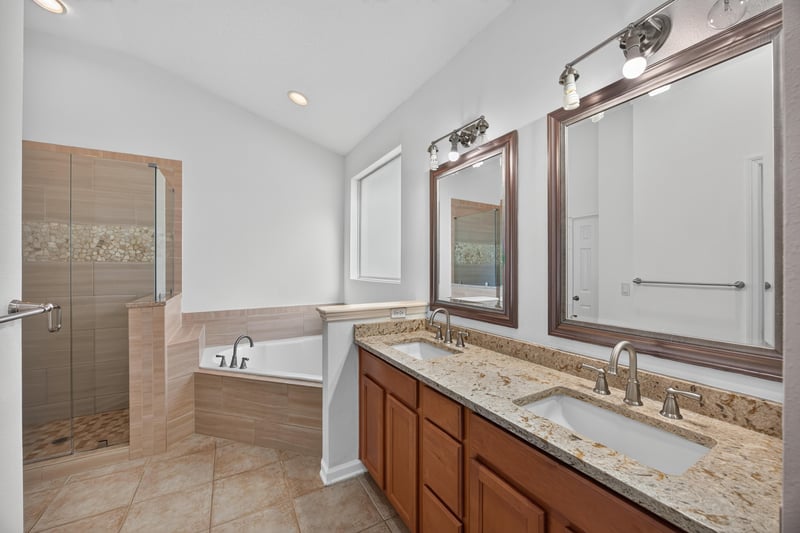 Primary bathroom with soaking tub and dual vanity at 3101 E Banister Rd, St. Augustine, FL 32092