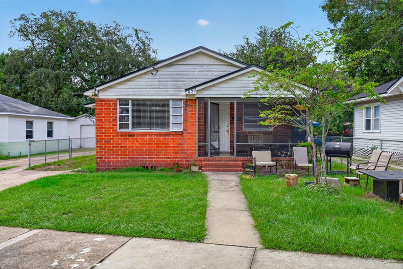 Front exterior with sidewalk and patio seating at 450 E 46th St, Jacksonville, FL 32208