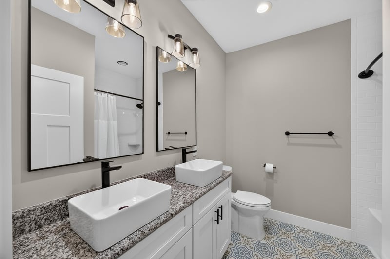 Bathroom with double vessel sinks and mirrors at 175 Alava Ct