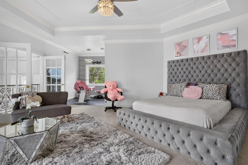 Bedroom with tufted gray headboard at 344 Broward Rd, Jacksonville, FL