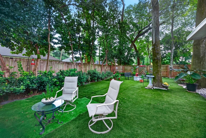 Backyard lawn with patio chairs at 1346 Gately Ct, Jacksonville, FL 32225