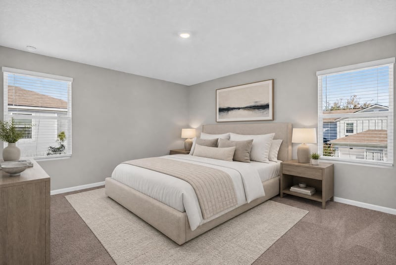 Primary bedroom with staged bed and nightstands at 4024 Bay Hawk Ct, Jacksonville, FL
