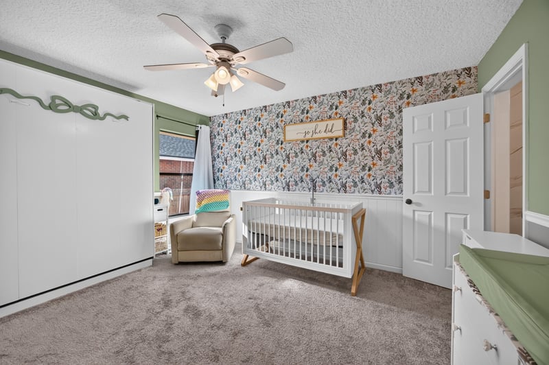 Bedroom set up as a nursery with crib at 2125 Blue Heron Cove Dr, Orange Park, FL 32003