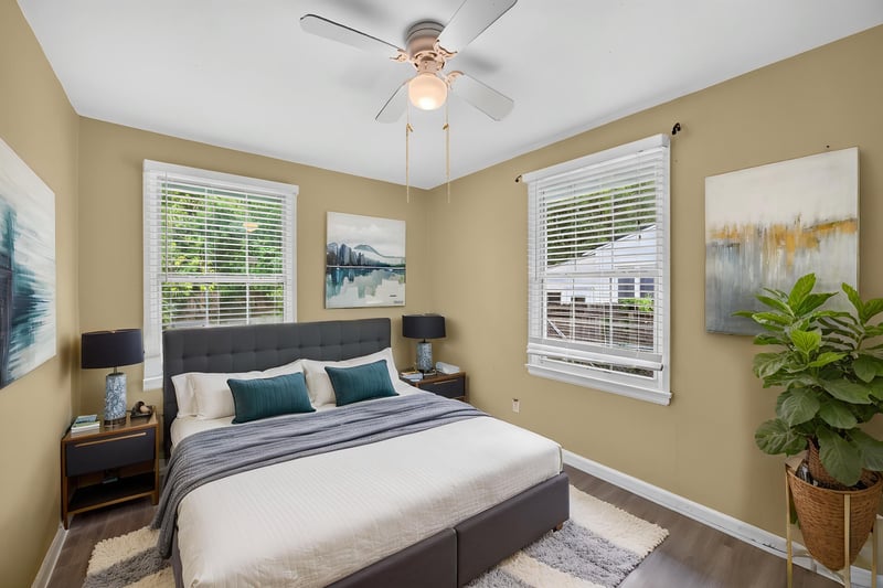 Bedroom with staged bed, windows and ceiling fan at 2841 Ernest St, Jacksonville, FL 32205