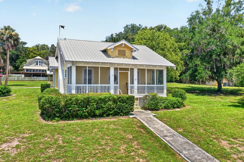 Drone close view of house with screened porch at 101 N Lake St, Crescent City, FL