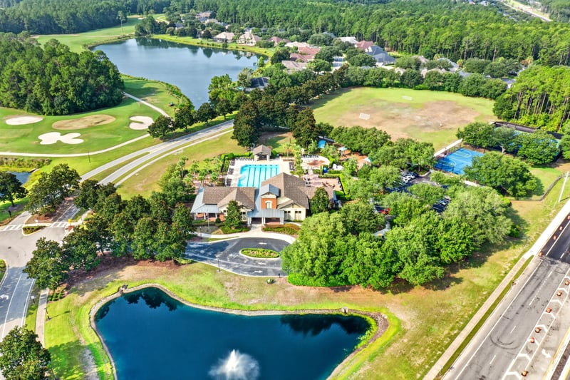 Aerial of clubhouse, pool and pond in South Hampton