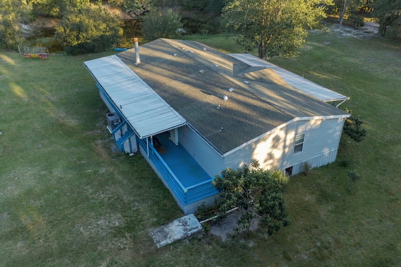 Aerial view of rooftop and porch, photographed by Megapixeler on Secret Cove Rd, Middleburg, FL