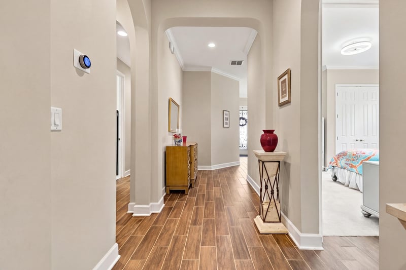 Entry hallway with decor, photographed by Megapixeler on Lucena Ln, Jacksonville, FL